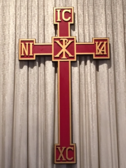 A cross with the roman numerals for chi rho and chi omega.